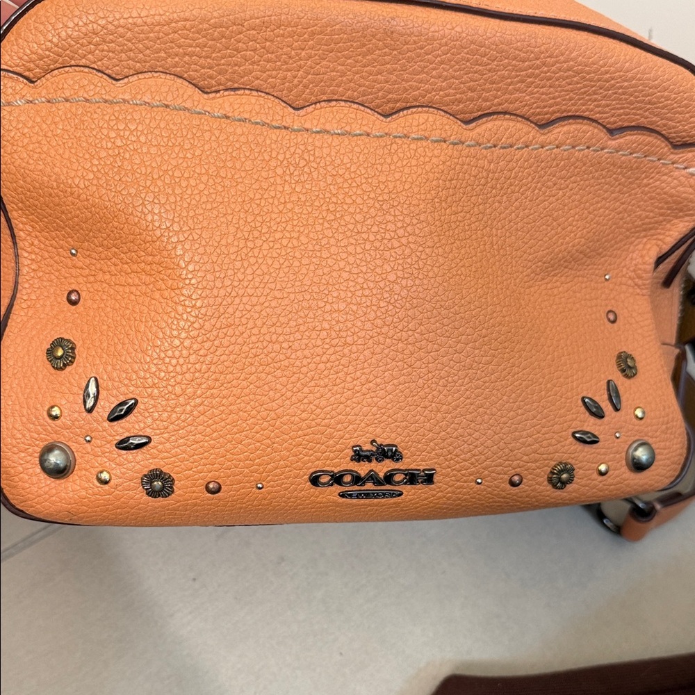 Coach Orange Pebbled Leather Crossbody with Stud Accents